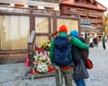People stand by a makeshift memorial outside the Constellation bar