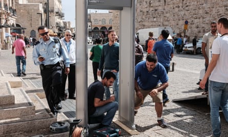 Police install a metal detector at the Jaffa gate for security screening at an entrance to the old city in Jerusalem.