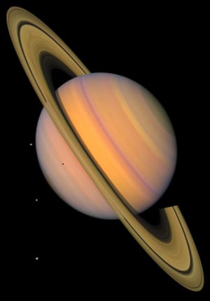 Voyager 2 approach Saturn in August 1981. This enhanced-colour picture shows the planet, its rings, and four of its icy satellites