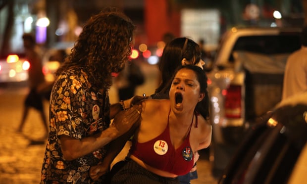 Supporters of the Socialist candidate Fernando Haddad argue with supporters of the far-right candidate Jair Bolsonaro after the results of the elections, in Rio de Janeiro.