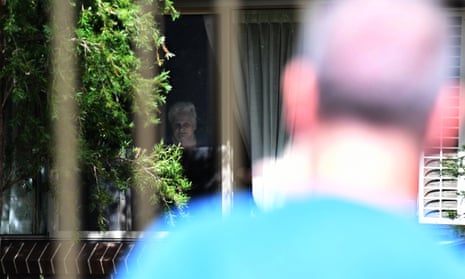 Anthony Bowe is seen by his mother Patricia Shea from outside the perimeter fence of the Newmarch House aged care home in Penrith, in Sydney’s west.