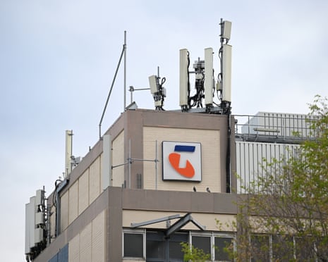 Signage and telecommunications infrastructure is seen on the exterior of the Telstra Exchange building in North Melbourne