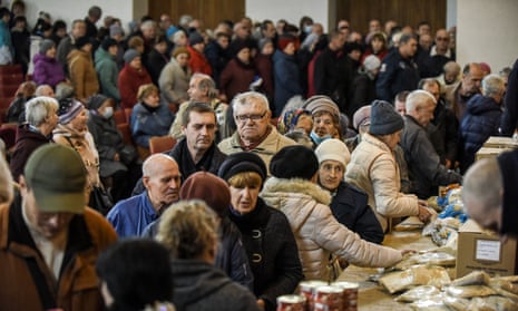 Ukrainians receive food aid at the end of a Sunday service at the Dobra Zvistka church in Kramatorsk, Donetsk region, eastern Ukraine.