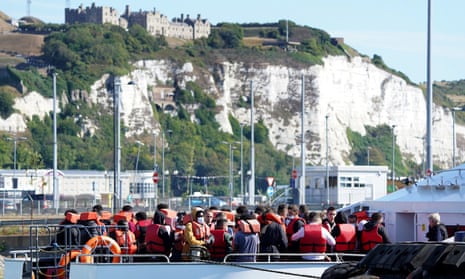 People are brought to Dover on a Border Force vessel on Tuesday