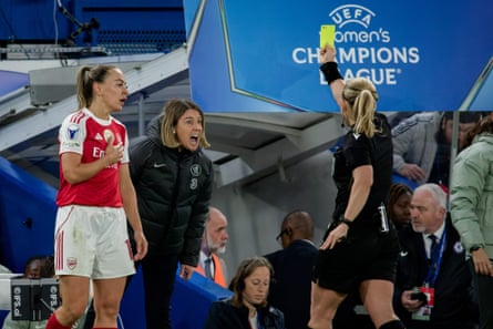 Chelsea manager Sonia Bompastor is shown a second yellow card.