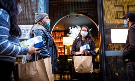 International student Alissa from Indonesia, picks up a supplies package and free meal from Melbourne restaurant Tian38.