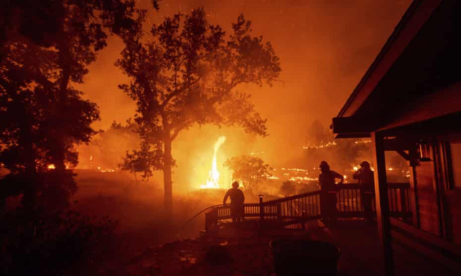 Firefighters encounter a wildfire, the fifth largest in California history, in Napa county California on 21 August 2020.