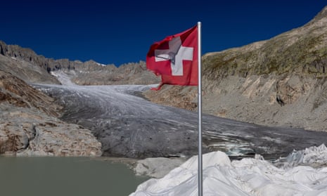 A Swiss flag at the Rhône glacier in Obergoms, Switzerland