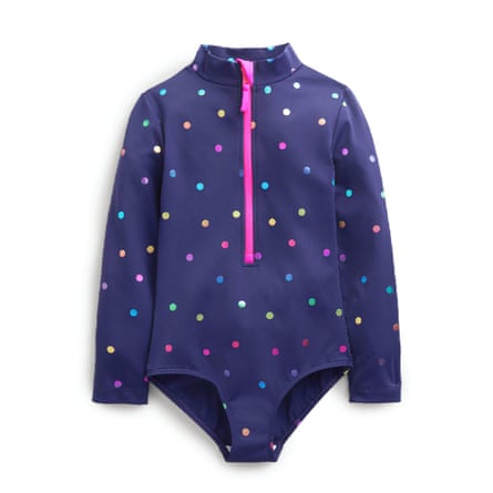 A navy long-sleeved swimsuit with rainbow polka dots