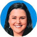 woman smiling against blue background