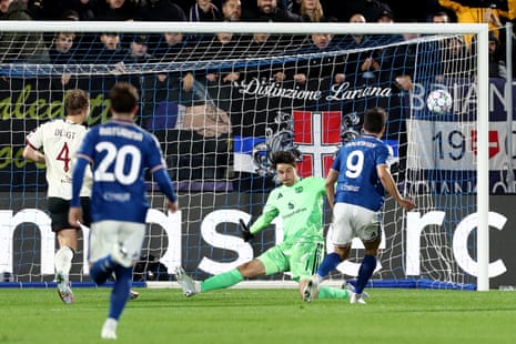 Douvikas of Como watches the ball fly past a diving goalkeeper into the net
