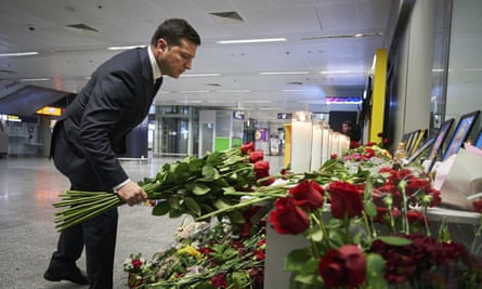 The Ukrainian president, Volodymy Zelenskiy, pictured laying flowers for the victims of the plane crash, called for ‘assurances of readiness for full and open investigation’ from Iran.