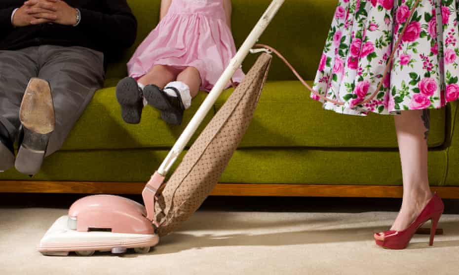1950s style woman hoovering