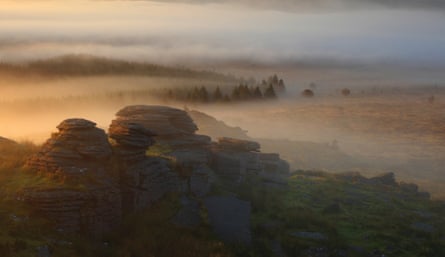 This photograph captures the mystical atmosphere of Dartmoor at dawn during the transition of seasons from summer to autumn