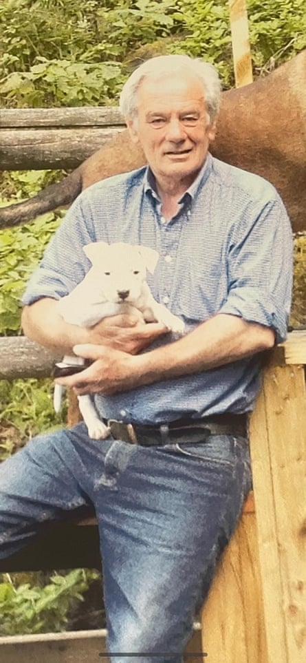 Ian Rawle holds a lamb.