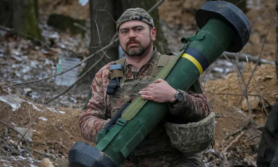Ukrainian service member holds a Javelin missile system at a position on the front line in the north Kyiv region, on 13 March.