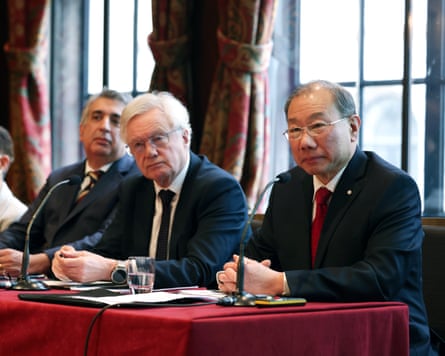 Mark McDonald, David Davis and Dr Shoo Lee answering questions while sat at a table with microphones on it