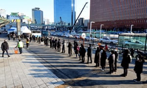 People form a long queue at a Covid-19 testing station in Seoul, South Korea, on 4 February 2022.