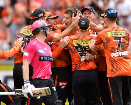 Aaron Hardie is congratulated by teammates after dismissing Sixers dangerman Steve Smith.