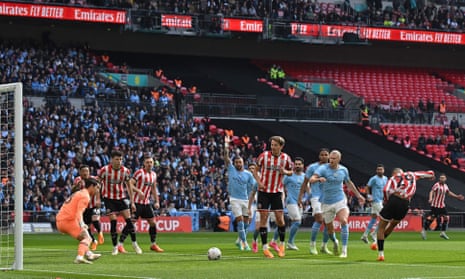 Sheffield United’s Iliman Ndiaye (right) shoots during the FA Cup semi-final football match between Manchester City and Sheffield United.