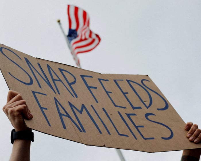 Trump administration says it will partially fund Snap food aid benefits– live