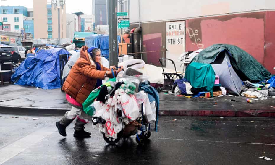 skid row tents, woman pushes cart