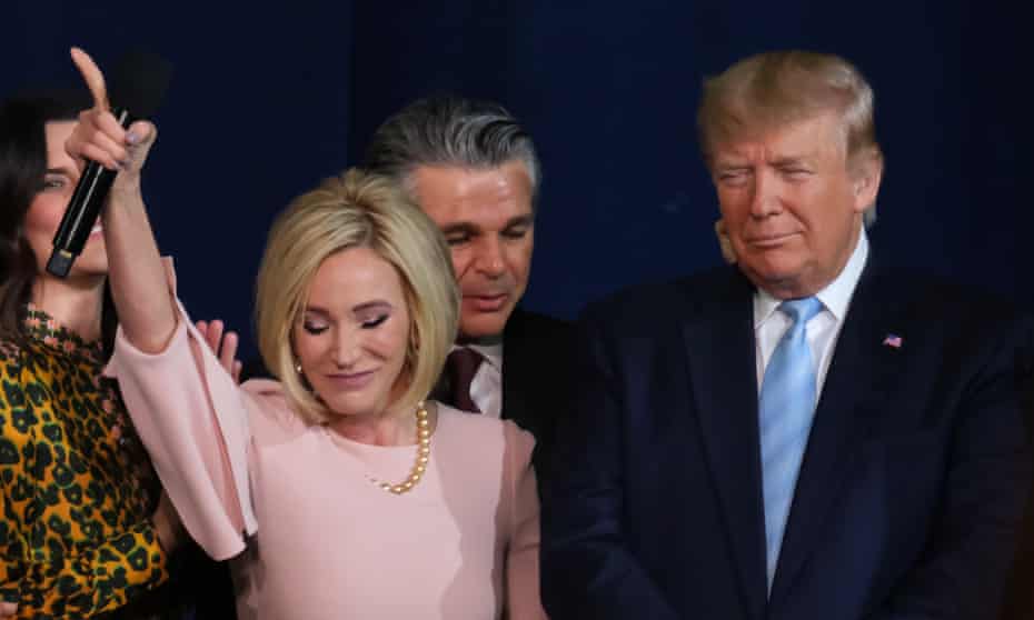 Paula White prays with Donald Trump.