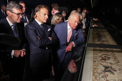 Left to right: Andy Burnham, France's President Emmanuel Macron and King Charles III inspecting the the Bayeux Tapestry at the British Museum in London.