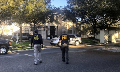 Federal agents search the home of Congressman Henry Cuellar in Laredo, Texas, on Wednesday.