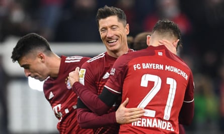 Robert Lewandowski celebrates with his Bayern teammates at full-time.