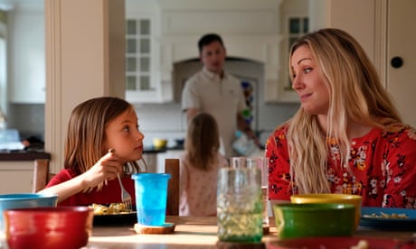 OB-GYN Dr. Kylie Cooper sits at the dinner table with her daughter, Hazel, Thursday, June 15, 2023, in Minnesota. The family is settling into the new house after moving. They’re figuring out new schedules and looking for new friends. “Basically,” Cooper said, “we’re trying to find what we had in Idaho.” (AP Photo/Abbie Parr)