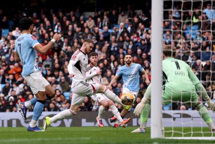 Alfie Dorrington diverts the ball past his goalkeeper for Manchester City’s first goal