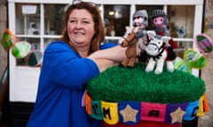 Tracey Brennan with the knitted Ant and Dec postbox cover outside her shop.
