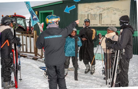 Instructor pointing at map with people watching
