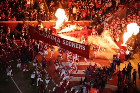 The Oklahoma Sooners take the field prior to Friday’s game.