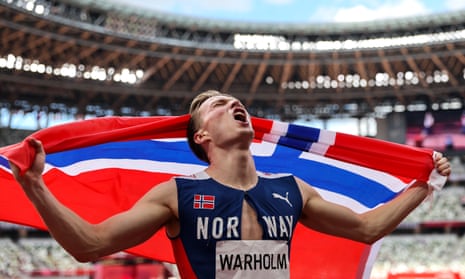 Karsten Warholm celebrates after winning the 400m hurdles