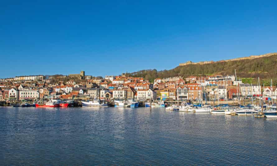 Harbor seafront town with castle on hill: Scarborough