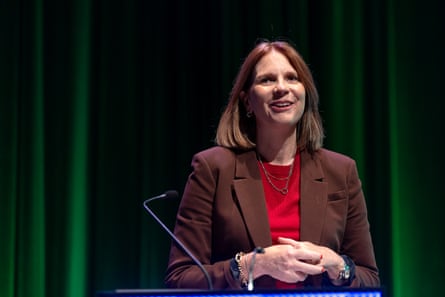 A woman in front of a microphone.