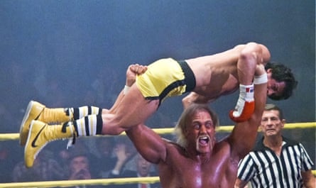Hulk Hogan holds Sylvester Stallone aloft in the wrestling ring in Rock III (1982).