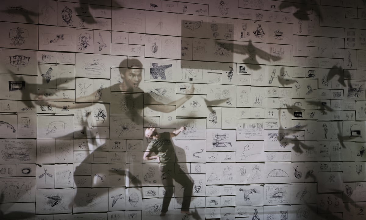 A wall covering in drawings on paper and projections of birds and men
