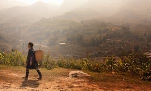Black Hmong Tribe women walking in the mountains near Sapa in Vietnam.