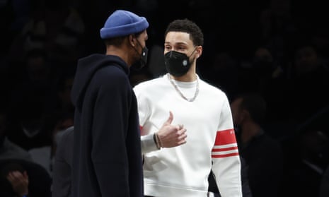 Ben Simmons, right, speaks with new Brooklyn teammate Kevin Durant during a Nets home game this week.