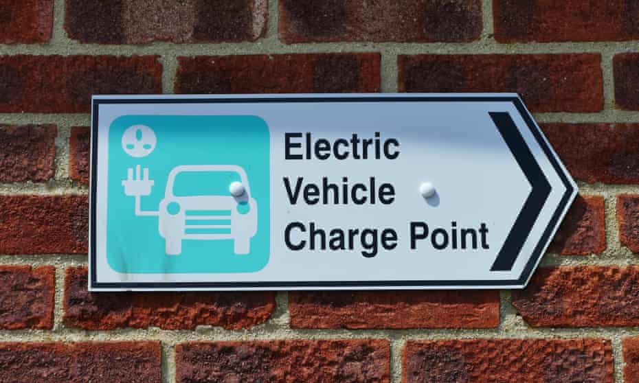 Electric car charging point sign on a wall
