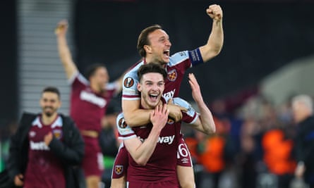 Mark Noble leaps on Declan Rice after West Ham’s Europa League win over Sevilla in March