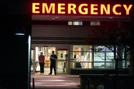 A security guard stands at an emergency department entrance at Central Maine Medical Center.