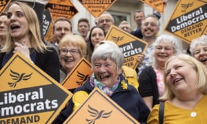 Liberal Democrat campaigners cheer Vince Cable in Cheltenham