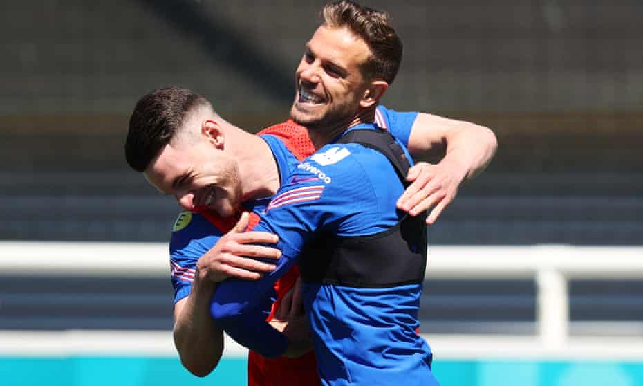 Jordan Henderson jokes with teammate Declan Rice during an England training session at St George’s Park on Wednesday