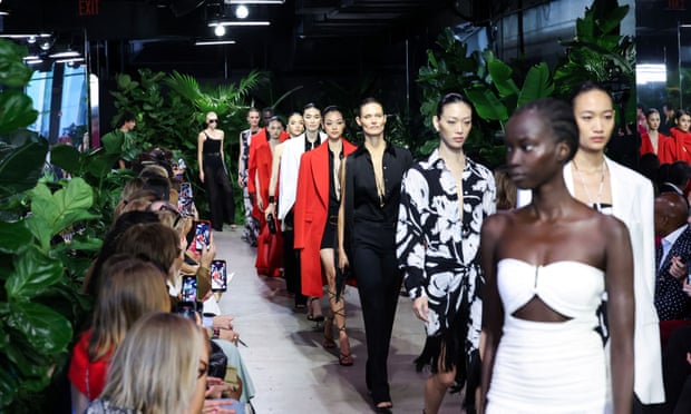 Models walking the runway for the closing of Michael Kors' Spring 2023 show. 
