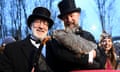 Men in suits and top hats with groundhog