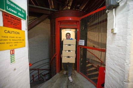 An employee carries boxes of micro-green salad from the elevator Growing Underground. The farm’s clients include Tesco, Marks &amp; Spencer and Ocado.